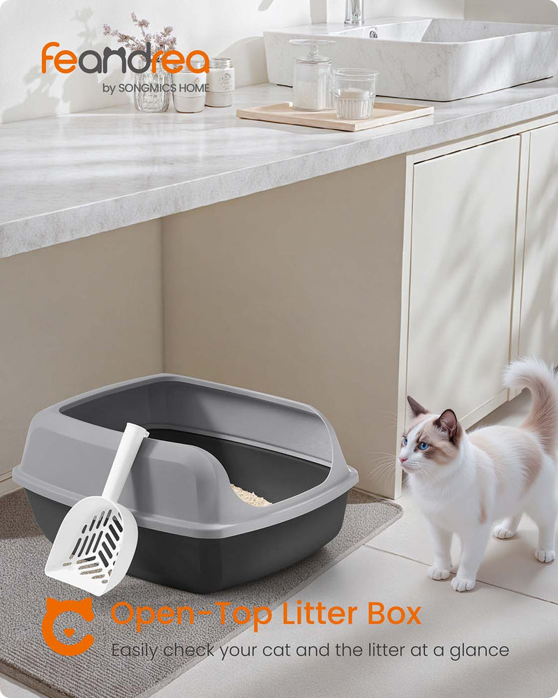 Cat stepping into the slate grey litter box