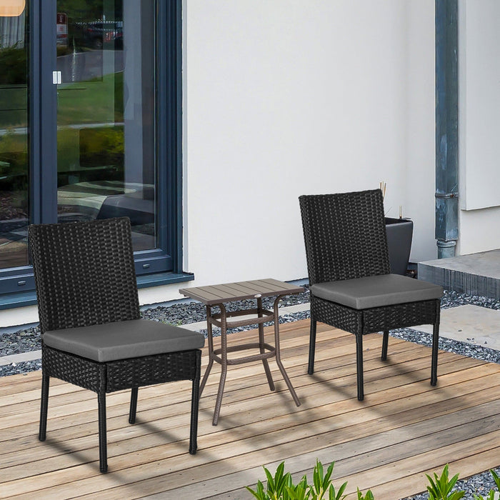 Pair of Black Rattan Garden Dining Chairs With Dark Grey Cushions