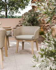 Roma round acacia sunray table with terrazzo insert and Eden Dawn chairs