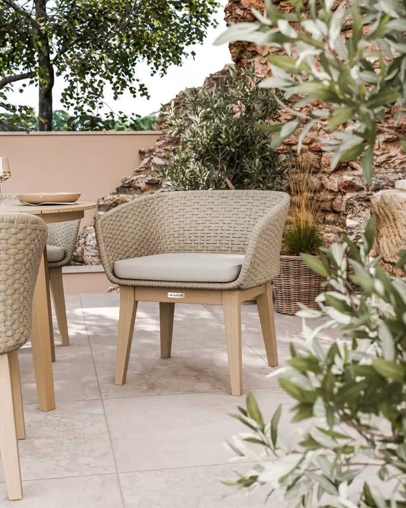 Roma round acacia sunray table with terrazzo insert and Eden Dawn chairs