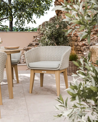 Roma round acacia sunray table with terrazzo insert and Eden Dusk chairs
