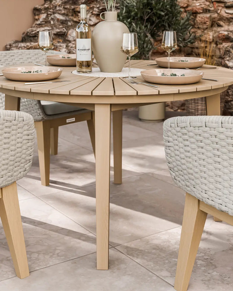 Roma terrazzo dining set on a patio with warm beige Eden Dusk chairs