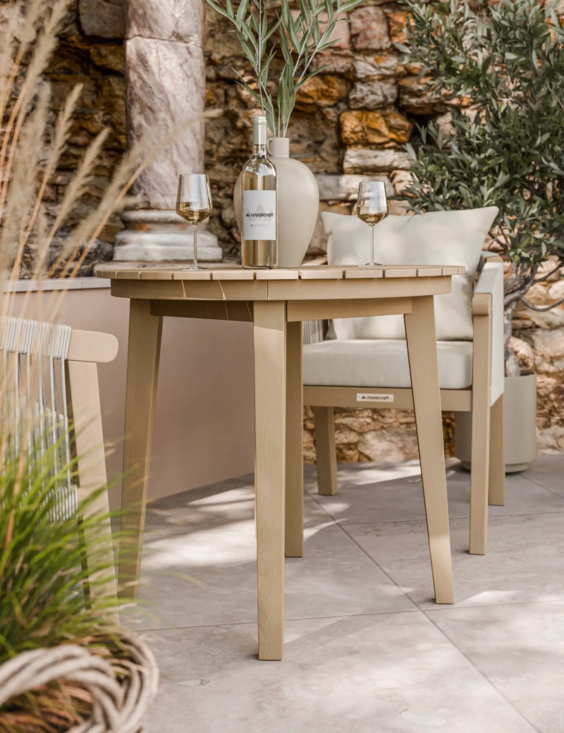 Roma acacia bistro table and rope chairs on a patio