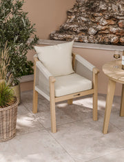 Roma rope dining chair with cushion beside the bistro table