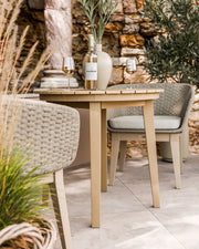 Roma acacia bistro table and Eden Dawn chairs on a patio