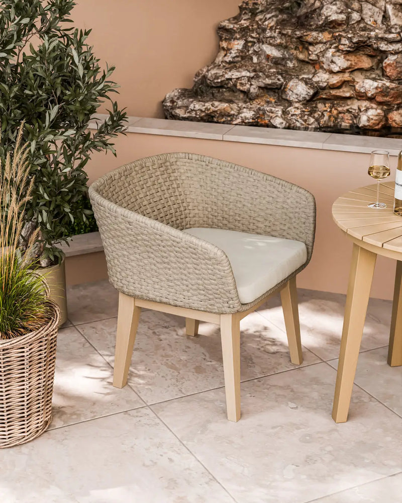 Eden Dawn sand rope chair beside the Roma bistro table