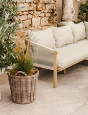 Roma acacia wood garden corner sofa and 90cm square coffee table on a patio