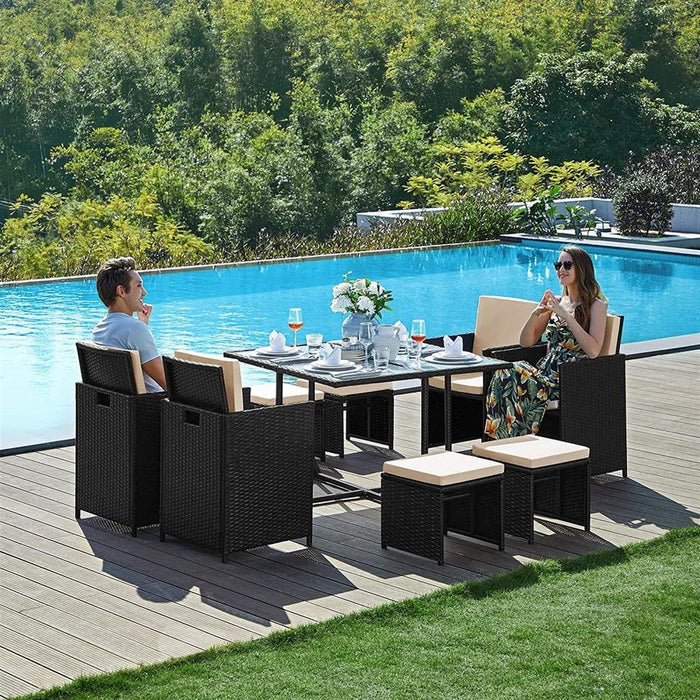 Image of a Black Rattan Cube Patio Furniture Set With Cream Cushions