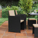 Image of a Black Rattan Cube Patio Furniture Set With Cream Cushions
