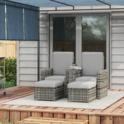 Image of a grey rattan outdoor garden furniture set with 2 reclining armchairs, footstools, storage and a drinks table