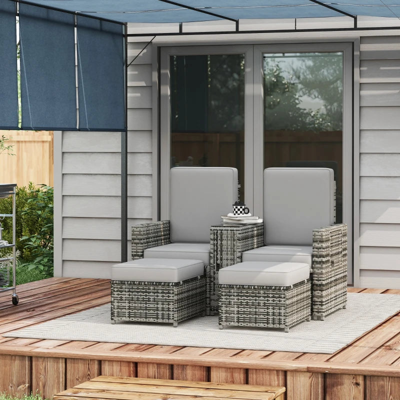 Image of a grey rattan outdoor garden furniture set with 2 reclining armchairs, footstools, storage and a drinks table