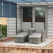 Image of a grey rattan outdoor garden furniture set with 2 reclining armchairs, footstools, storage and a drinks table