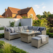 Royalcraft Wentworth 8 seater rattan corner dining set with square gas fire pit table in a garden