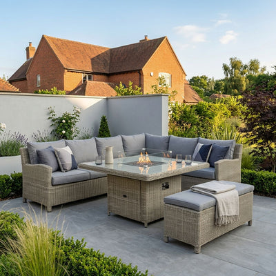 Royalcraft Wentworth 8 seater rattan corner dining set with square gas fire pit table in a garden