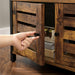 Image of a small bookcase with door by Vasagle Furniture. This industrial style cabinet has 4 spacious shelves and a cabinet with louvered doors. 