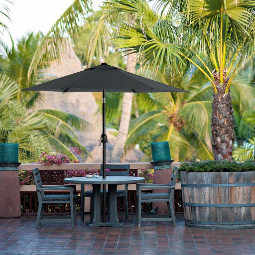 Image of a grey garden parasol with a crank handle