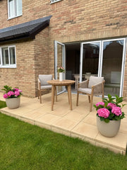 Roma bistro table and rope chairs outdoors