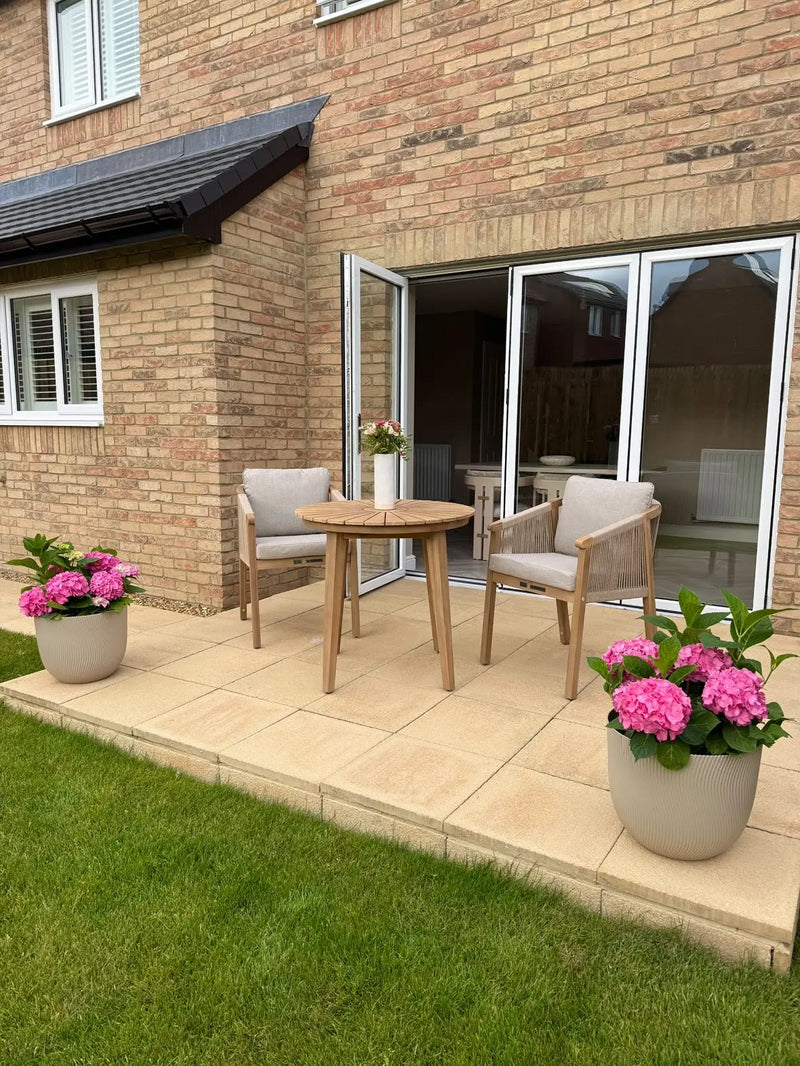 Roma bistro table and rope chairs outdoors