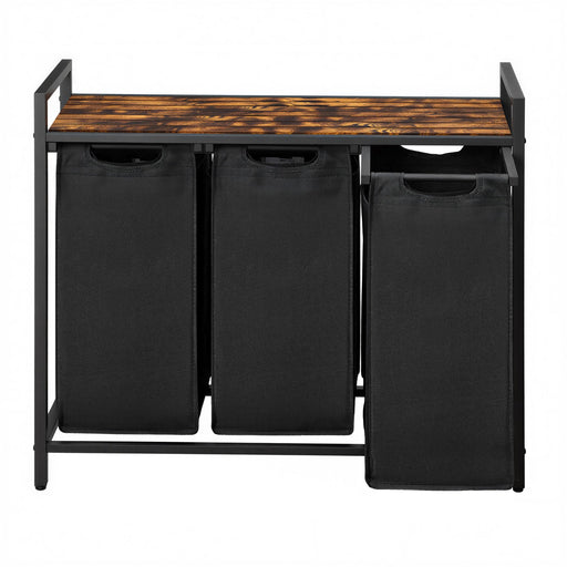3 black laundry bags on a wooden top shelf with a metal frame.