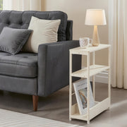 Side table used as a bedside table with charging cables tidied