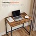 Image of a small desk for small spaces with a rustic brown tabletop and a black frame and legs. 