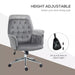 Image of a velvet grey desk chair with button tufted back and swivel wheels