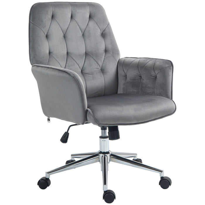 Image of a velvet grey desk chair with button tufted back and swivel wheels