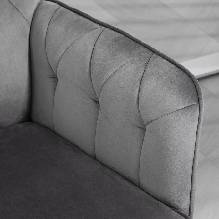 Image of a velvet grey desk chair with button tufted back and swivel wheels