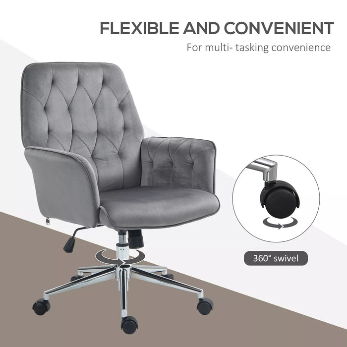 Image of a velvet grey desk chair with button tufted back and swivel wheels