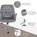 Image of a velvet grey desk chair with button tufted back and swivel wheels