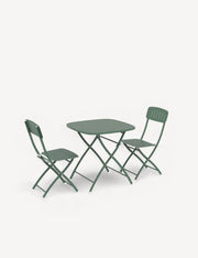 Green folding table and chairs on a white background