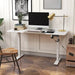 Image of a White Vinsetto Electric Sit Stand Desk With a White Tabletop and White Metal Legs and Frame. 