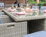 Royalcraft Wentworth 10 seater rattan cube dining set on a garden patio