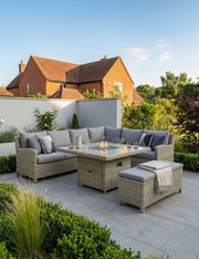Royalcraft Wentworth 8 seater rattan corner dining set with square fire pit table in a garden