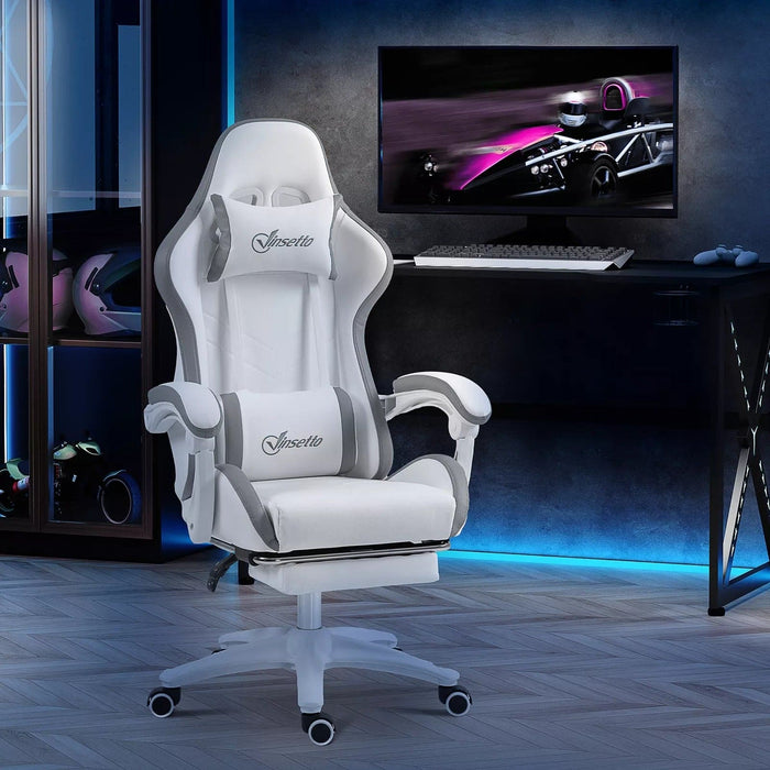 Image of a White Leather Gaming Chair by Vinsetto. The chair has swivel wheels, lumbar support and a neck pillow, a retractable leg rest, padded arms, height adjustment, tilt and a reclining backrest.