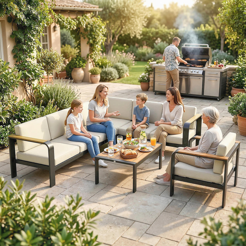 Family and friends enjoying a meal outdoors on a patio with outdoor furniture and grill.