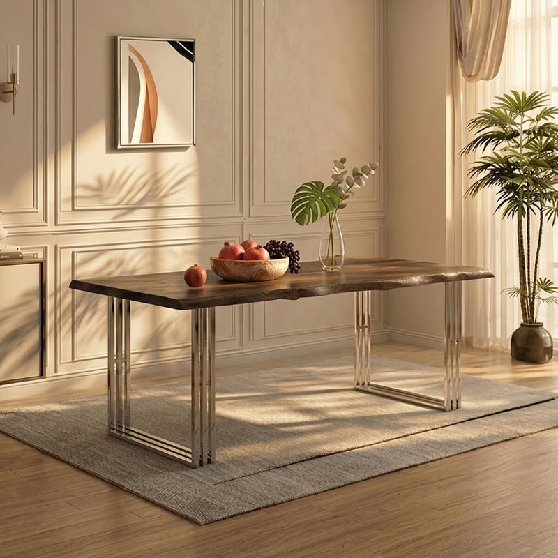 Natural acacia wood dining table with silver looped steel base set for a meal in a dining room