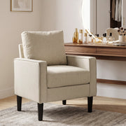 Cream accent chair beside a dressing table in a bedroom