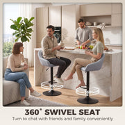 Four people at a marble island with two grey stools marked as 360 degree swivel seats