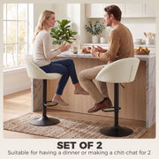 Couple chatting across a kitchen counter seated on cream white Homcom bar stools