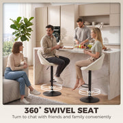 Family gathered at a kitchen island on cream bar stools marked with 360 degree swivel arrows