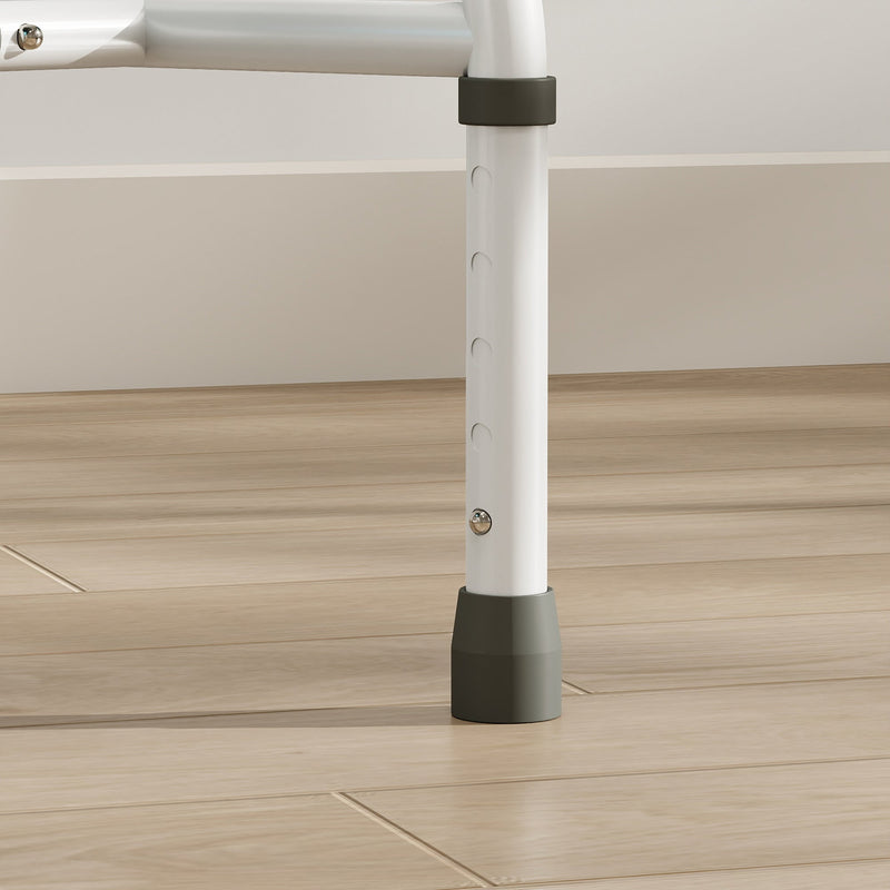 Close-up of an adjustable commode chair leg with height holes and grey rubber foot