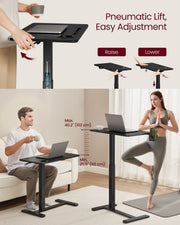 One-hand lift lever close-up and a standing user at the table's full height