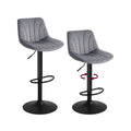 Pair of Vasagle grey velvet swivel bar stools shown side by side on a white background, one rotated to show the swivel action