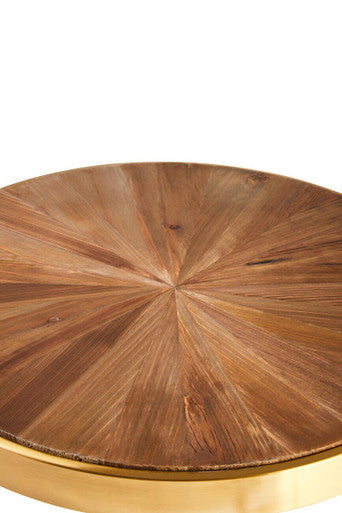 Close-up of the gold steel foot of the side table pedestal on a floor surface