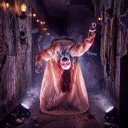 Broken-back ghost decoration displayed in a haunted house corridor with onlookers