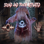 Broken-back ghost decoration reacting to a sound or touch trigger in a library setting