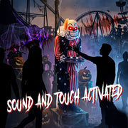 Animated candy tray clown decoration at a haunted carnival display with sound and touch activation