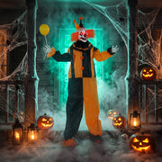 Balloon prop clown decoration lit up on a haunted porch display at night
