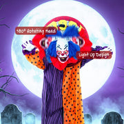 Clown decoration labelled with 180 degree rotating head and light-up design in front of a full moon